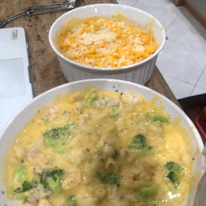 Two Dishes of Mac and Cheese one with Brocolli